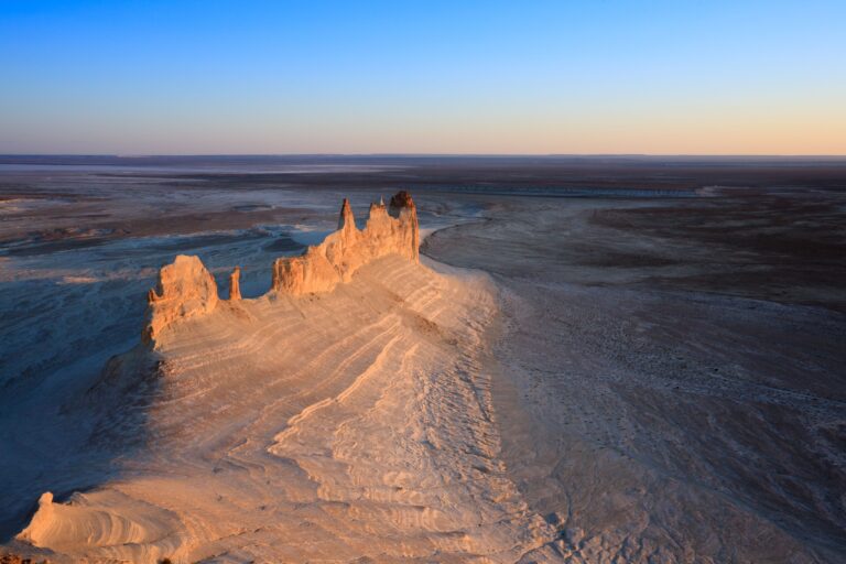 A stunning aerial view of the Bozzhira Canyon in the Ustyurt Plateau, Kazakhstan during sunset